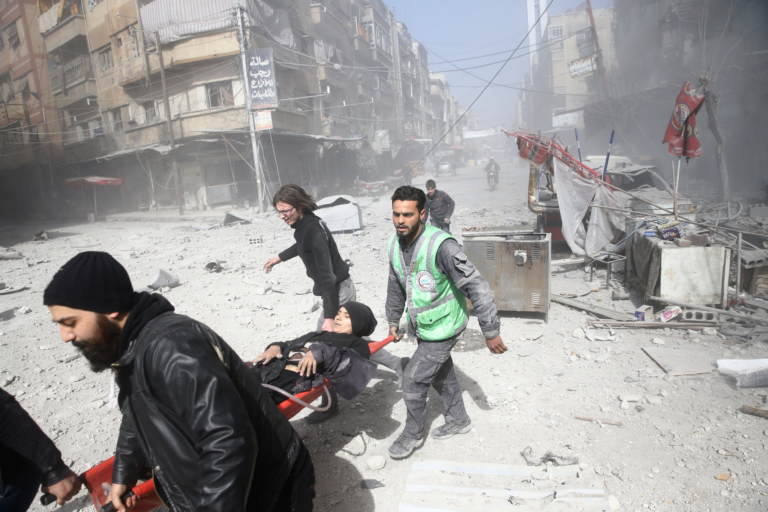 An injured woman is carried on a stretcher after an airstrike in the besieged town of Douma in eastern Ghouta in Damascus, Syria, February 7, 2018. REUTERS/ Bassam Khabieh