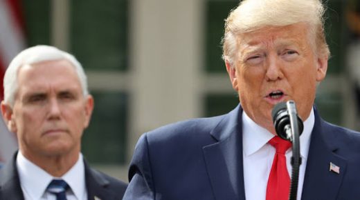 U.S. President Donald Trump declares the coronavirus pandemic a national emergency as Vice President Mike Pence listens during a news conference in the Rose Garden of the White House in Washington, U.S., March 13, 2020. REUTERS/Jonathan Ernst
